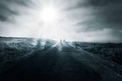 Road amidst landscape against sky