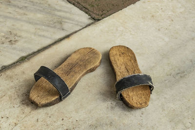 A pair of clogs for turkish bath.shoes with a thick wooden sole.