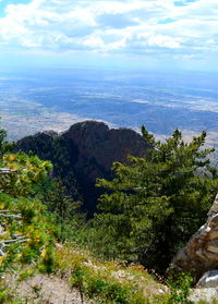 Scenic view of landscape against cloudy sky
