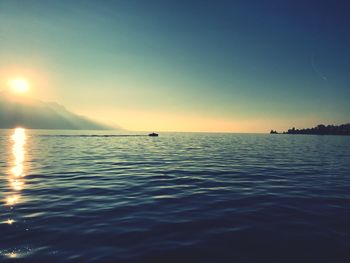 Scenic view of sea against clear sky during sunset