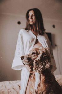 Young woman with dog at home