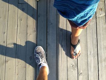 Low section of people standing on boardwalk