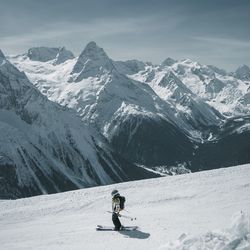 Man skiing on snowcapped mountain