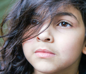 Close-up of thoughtful innocent girl looking away