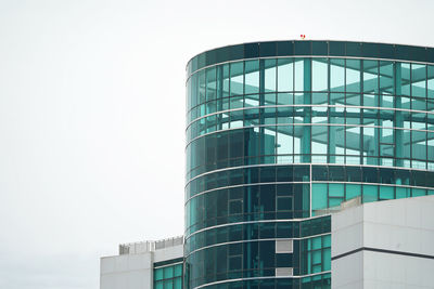 Low angle view of modern building against clear sky