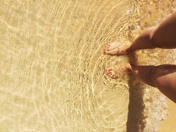 Low section of man on sand