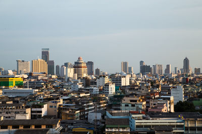 High angle view of buildings in city against sky