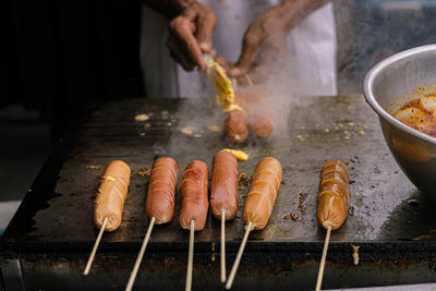 Midsection of man preparing food