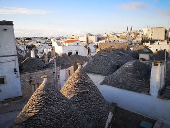 Buildings in city against sky