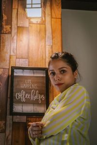 Portrait of young woman at cafe