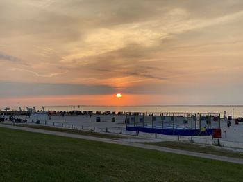 Scenic view of beach against sky during sunset