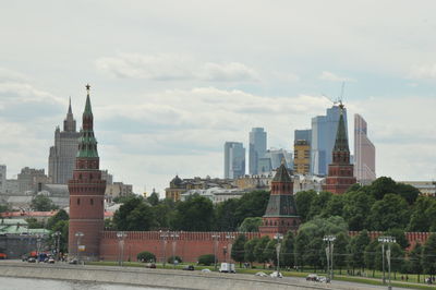 Corner arsenalnaya with kremlin wall by road in city
