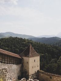 Built structure on mountain against sky