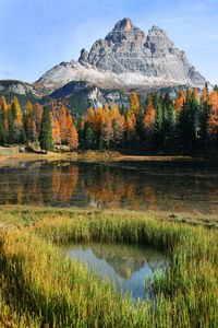 Scenic view of lake against mountain during autumn