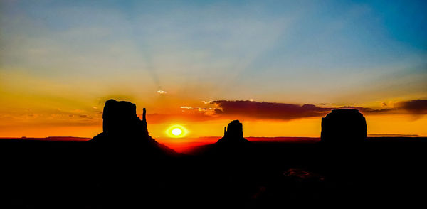 Scenic view of silhouette landscape against sky during sunset