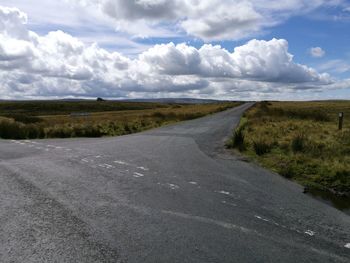 Road amidst landscape against sky