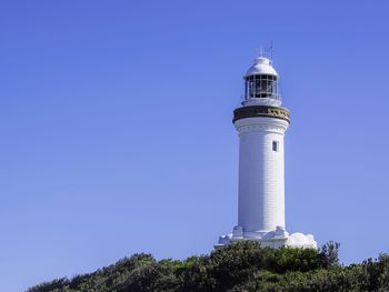 Low angle view of lighthouse against clear blue sky