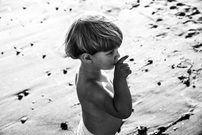 Boy standing on beach