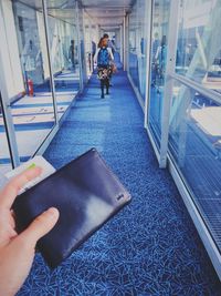 Midsection of woman holding umbrella