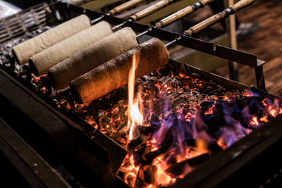 Baking chimney cakes at a budapest christmas market.