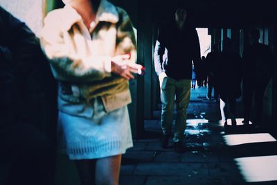 Rear view of people walking in corridor