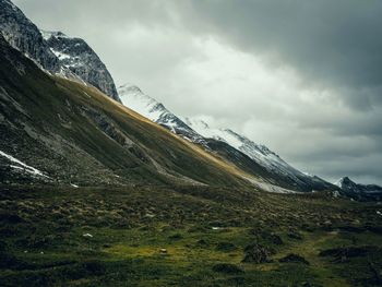 Scenic view of snowcapped mountains against sky