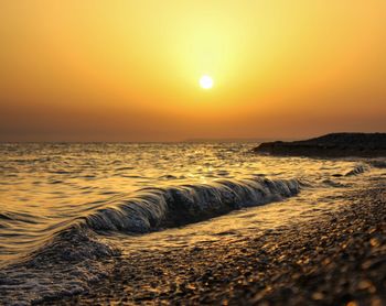 Scenic view of sea against sky during sunset