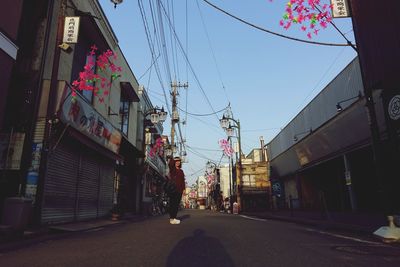 Street amidst buildings against sky