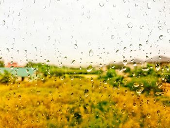 Full frame shot of wet glass window during rainy season