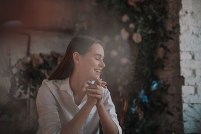 Young woman looking away outdoors