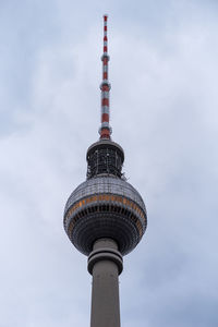 Low angle view of communications tower against sky