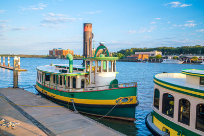 Boats moored at harbor