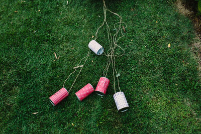 High angle view of pink umbrella on field