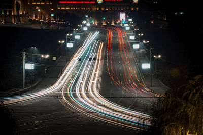 High angle view of light trails on road at night