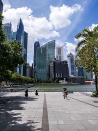 Buildings in city against sky