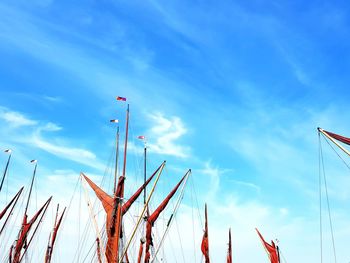 Low angle view of flag against blue sky