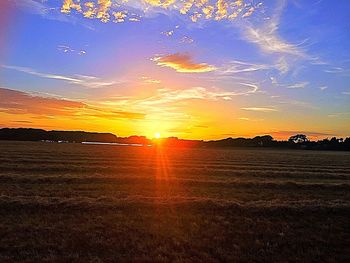 Scenic view of landscape at sunset