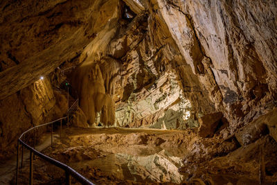 Formations in a karst cave. stalagmites and stalactites. path, walkway.