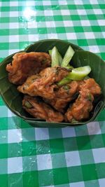 High angle view of meat in plate on table