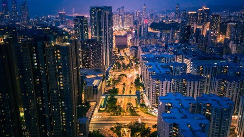 Aerial view of illuminated buildings in city at night