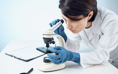 Doctor examining patient in laboratory