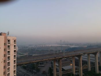 High angle view of bridge in city against sky