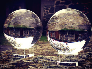 Close-up of crystal ball on glass table