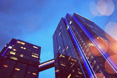 Low angle view of illuminated building against sky