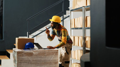 Side view of man working at home