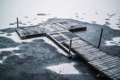 Bridge frozen into the ice of an ice covered lake