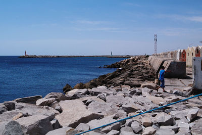 Scenic view of sea against blue sky