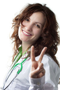 Portrait of a smiling young woman over white background