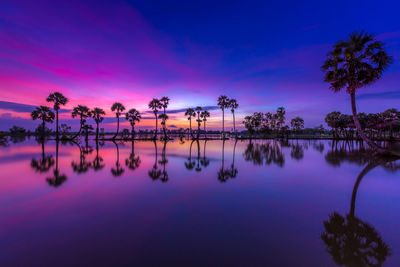 Scenic view of lake against sky during sunset