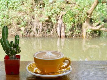 Close-up of coffee cup on table